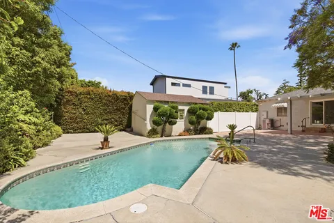 a view of a swimming pool with a lounge chairs
