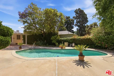 a view of a backyard with a garden