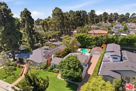 an aerial view of a house with a garden