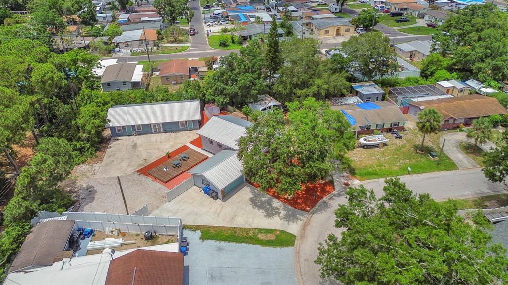 6515 Dimarco Road Tampa, FL 33634 - Photo 64 of 66 an aerial view of residential houses with outdoor space and street view