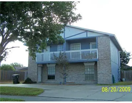 a view of a house with a garden
