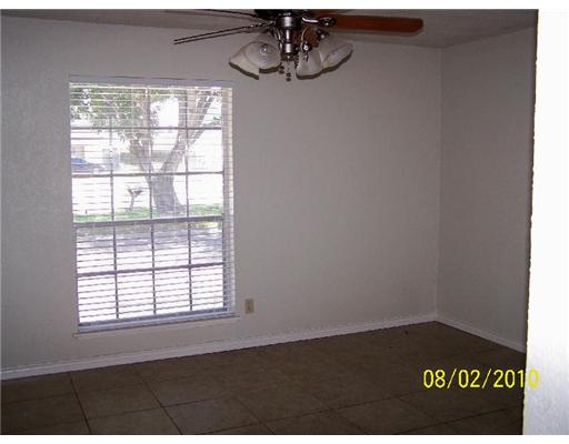 7222 Owen Court, Unit 2 Corpus Christi, TX 78413 - Photo 2 of 9 an empty room with a window