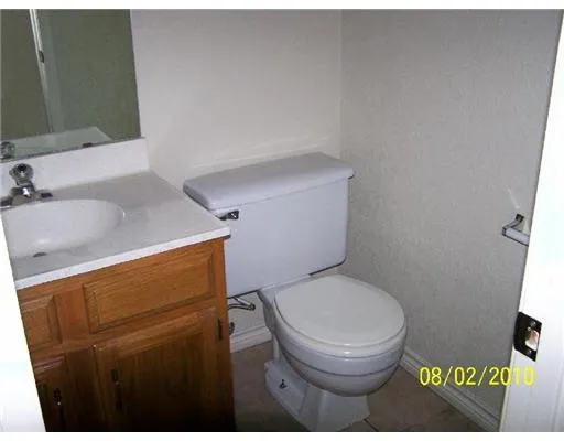 a bathroom with a toilet and a sink