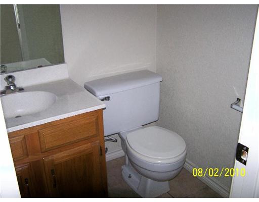 7222 Owen Court, Unit 2 Corpus Christi, TX 78413 - Photo 6 of 9 a bathroom with a toilet and a sink