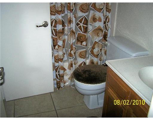 7222 Owen Court, Unit 2 Corpus Christi, TX 78413 - Photo 7 of 9 a bathroom with a toilet and a sink