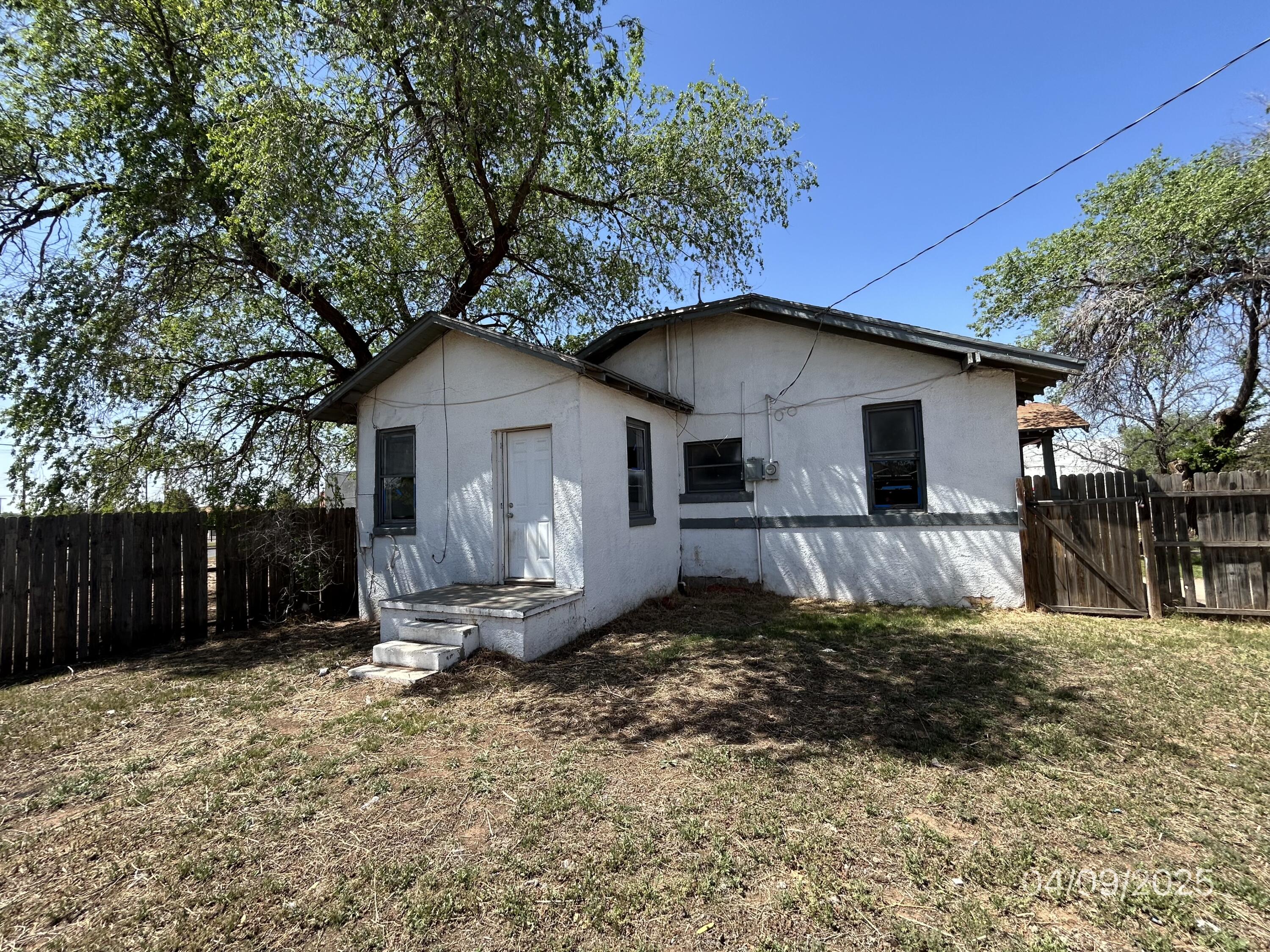 1921 Dixie Drive Lubbock, TX 79411 - Photo 3 of 19 a front view of a house with a yard