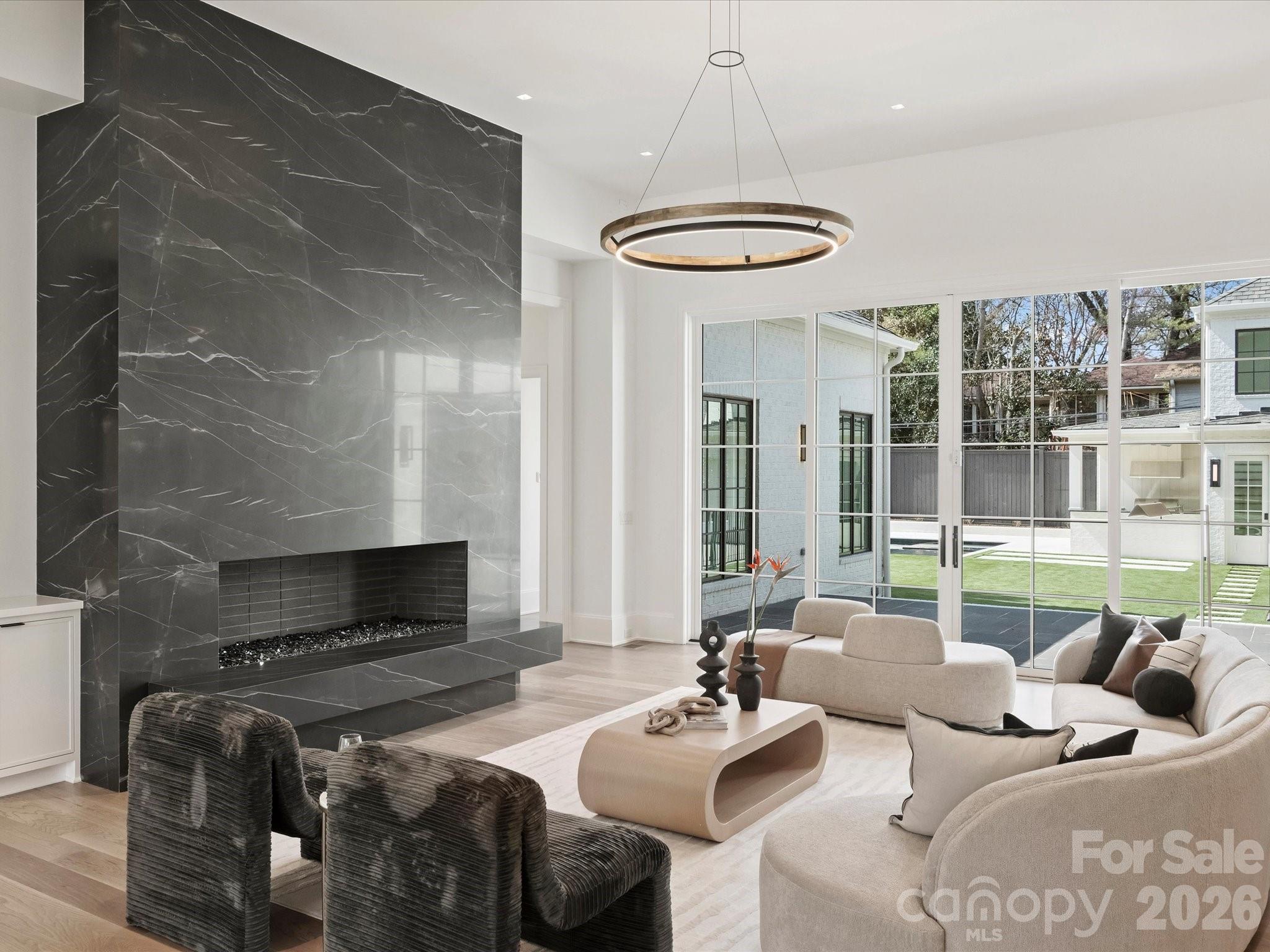 1436 Queens Road West Charlotte, NC 28207 - Photo 14 of 47 a living room with furniture a fireplace and a large window