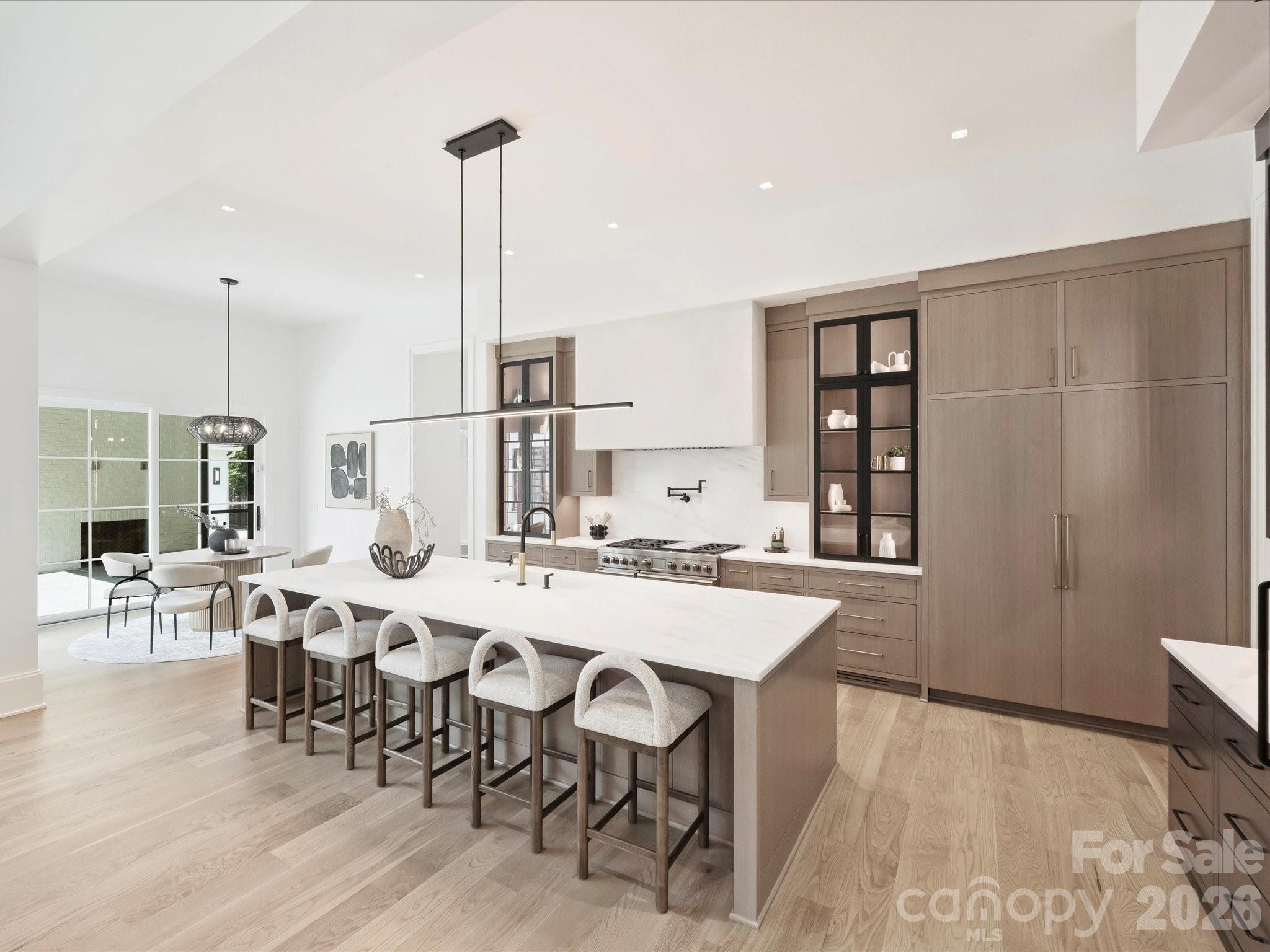 1436 Queens Road West Charlotte, NC 28207 - Photo 18 of 47 a view of a dining room with furniture and wooden floor