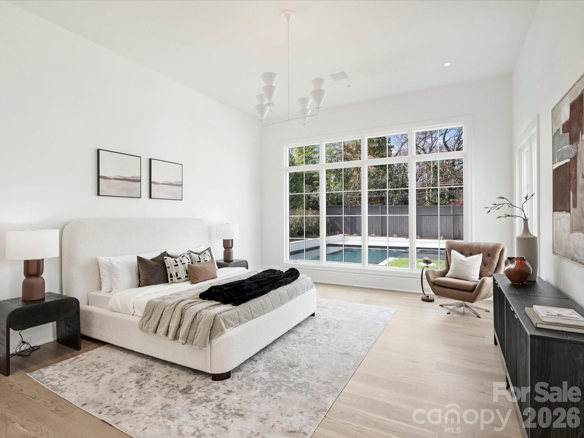 1436 Queens Road West Charlotte, NC 28207 - Photo 21 of 47 a spacious bedroom with a bed and glass window