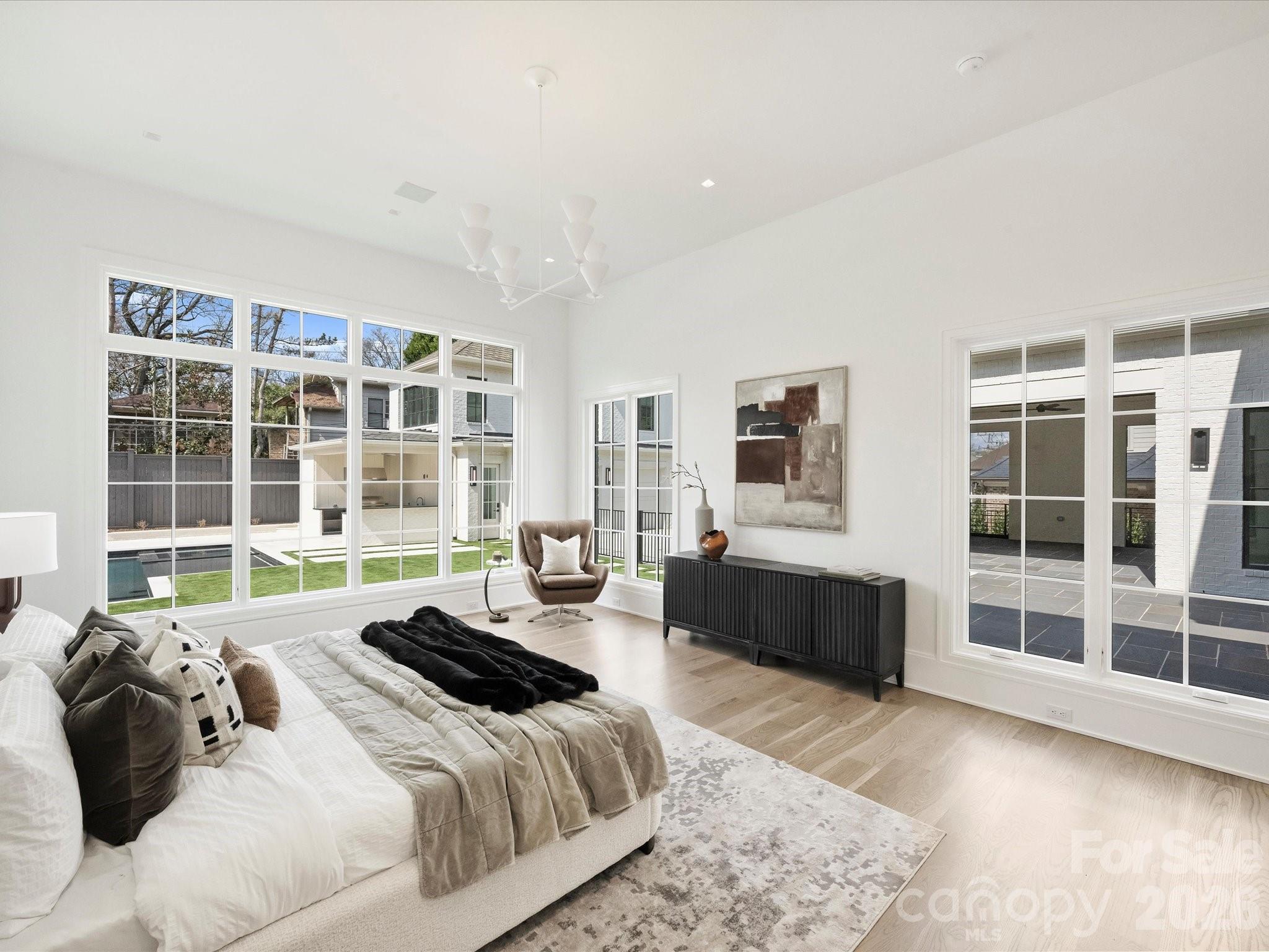 1436 Queens Road West Charlotte, NC 28207 - Photo 22 of 47 a large bedroom with a bed and glass window