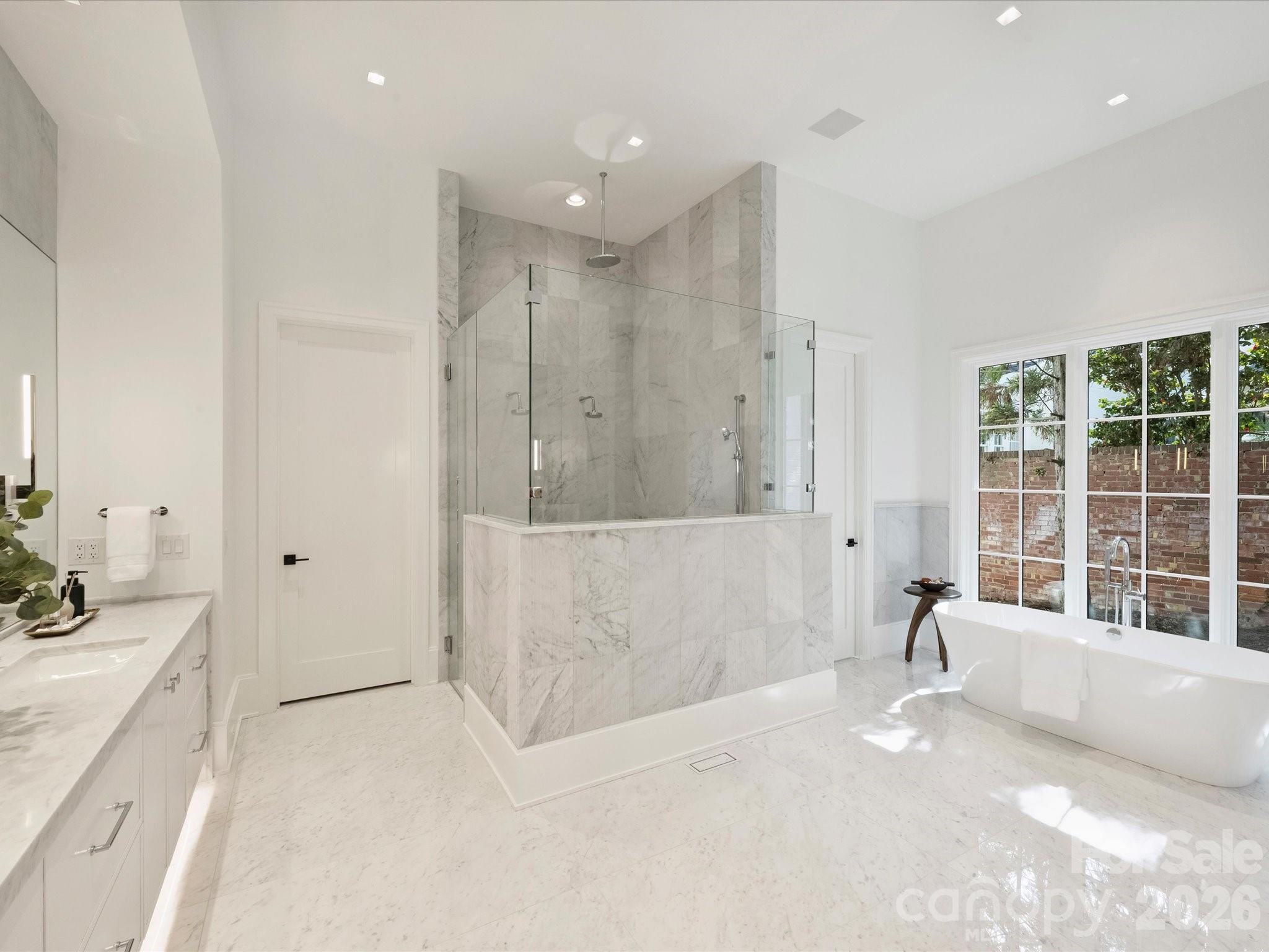 1436 Queens Road West Charlotte, NC 28207 - Photo 23 of 47 a large white tub sitting in a bathroom