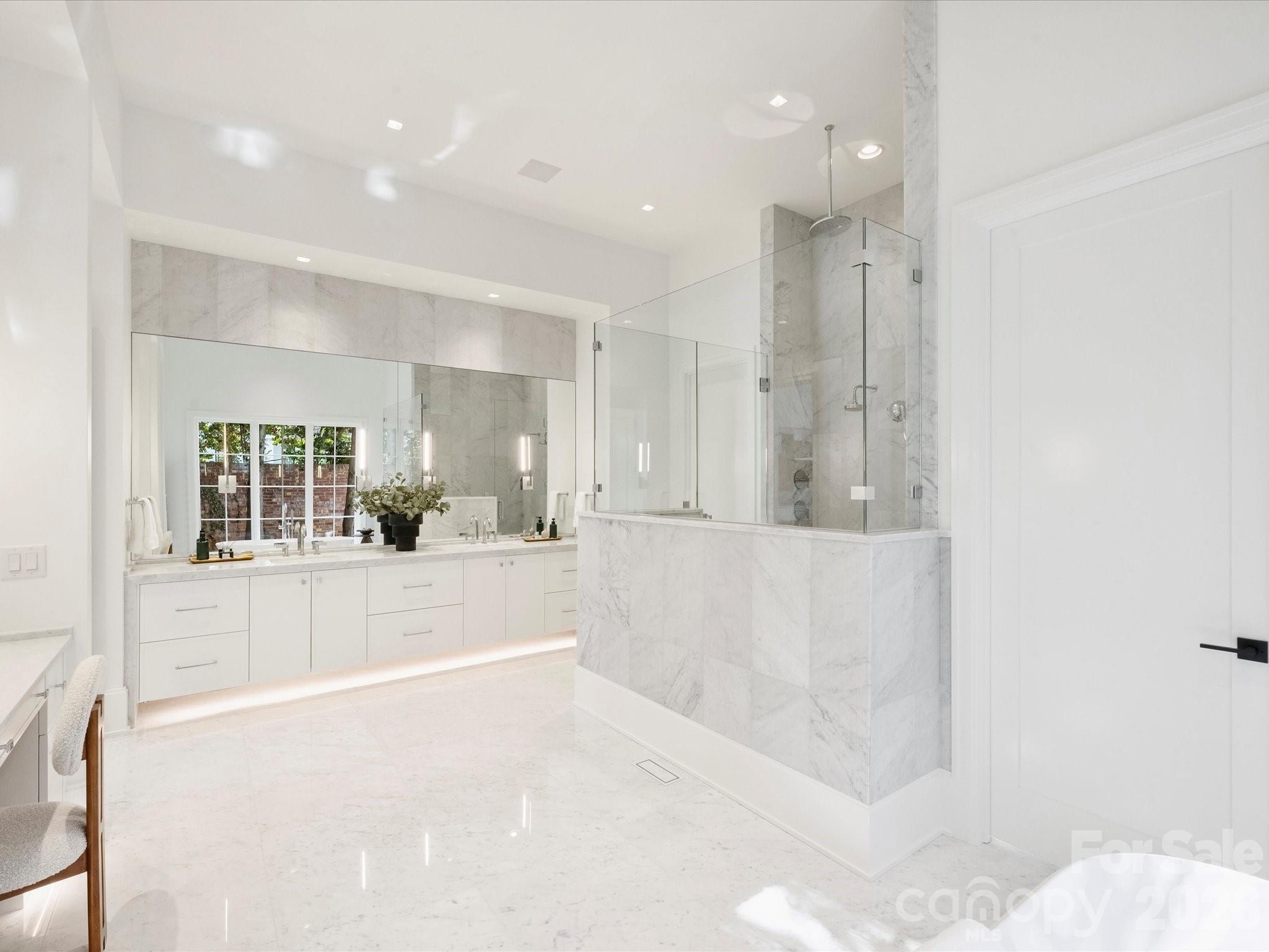 1436 Queens Road West Charlotte, NC 28207 - Photo 24 of 47 a large white kitchen with kitchen island a sink a stove and a refrigerator