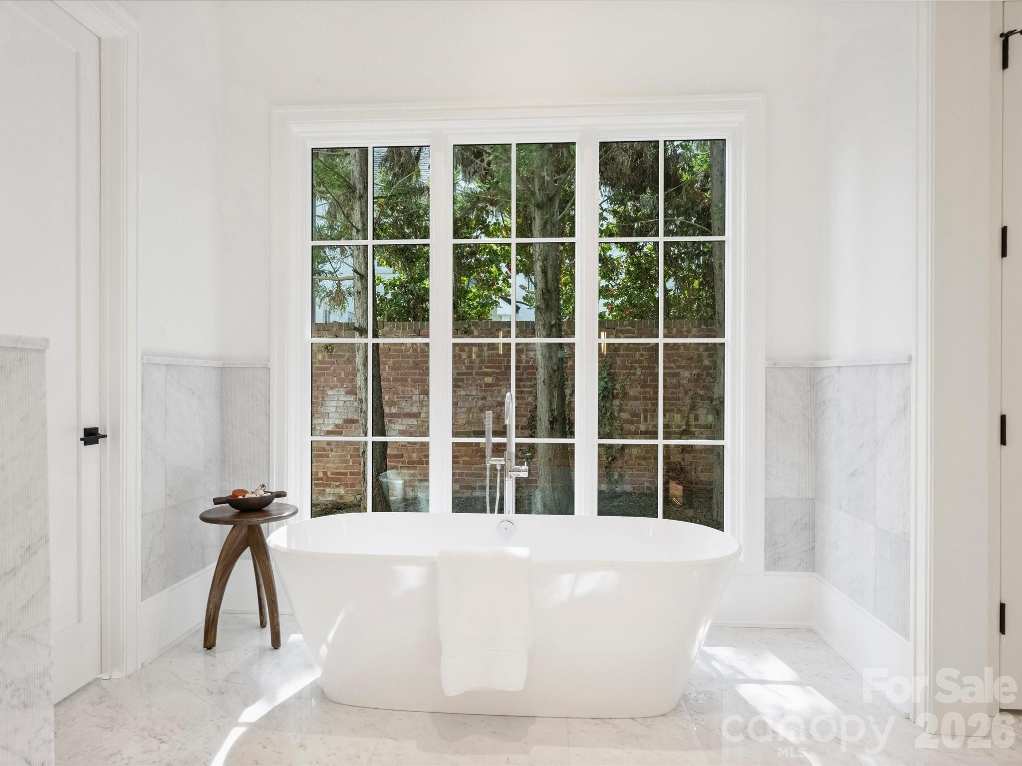1436 Queens Road West Charlotte, NC 28207 - Photo 25 of 47 a white bath tub sitting next to a window