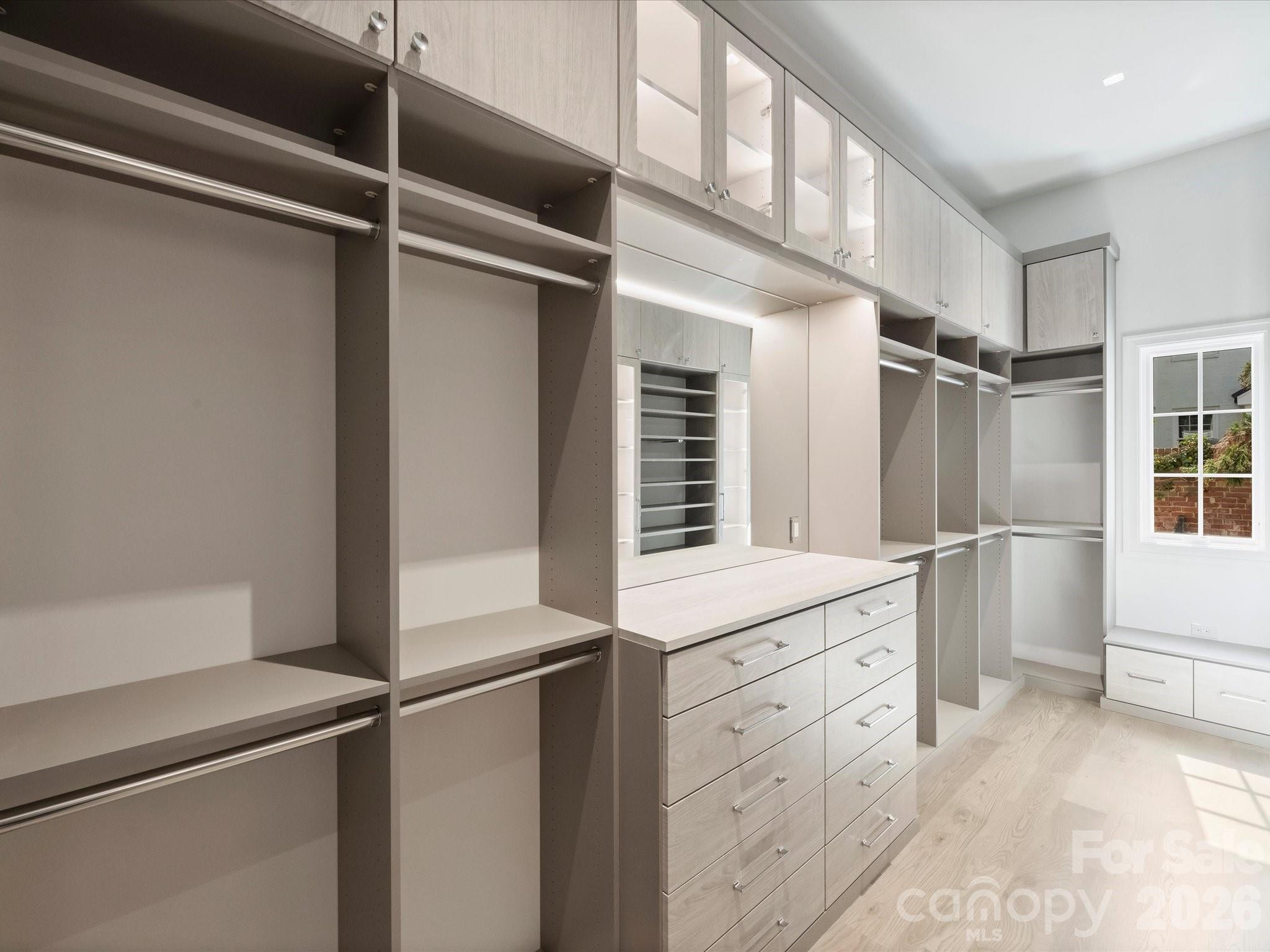 1436 Queens Road West Charlotte, NC 28207 - Photo 27 of 47 a kitchen with white cabinets and refrigerator
