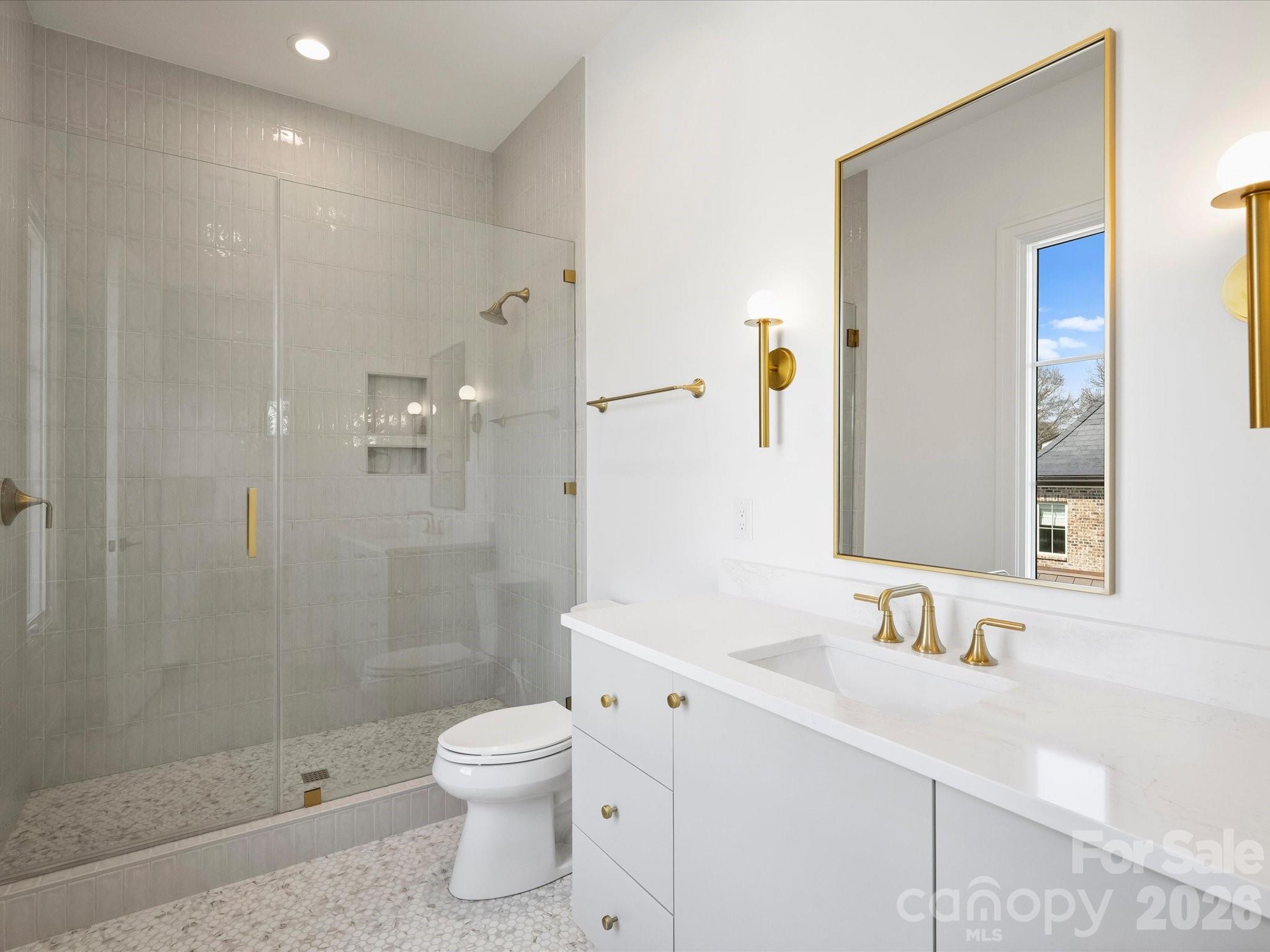 1436 Queens Road West Charlotte, NC 28207 - Photo 34 of 47 a bathroom with a granite countertop sink a toilet and shower
