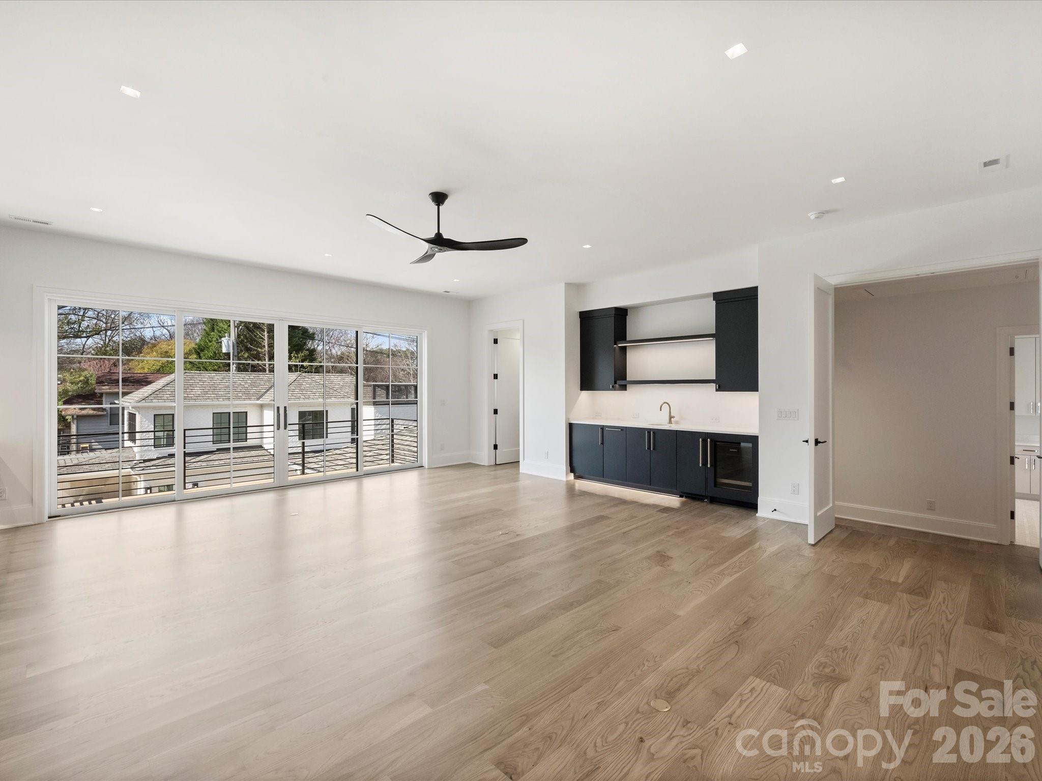 1436 Queens Road West Charlotte, NC 28207 - Photo 35 of 47 a big room with wooden floor and windows