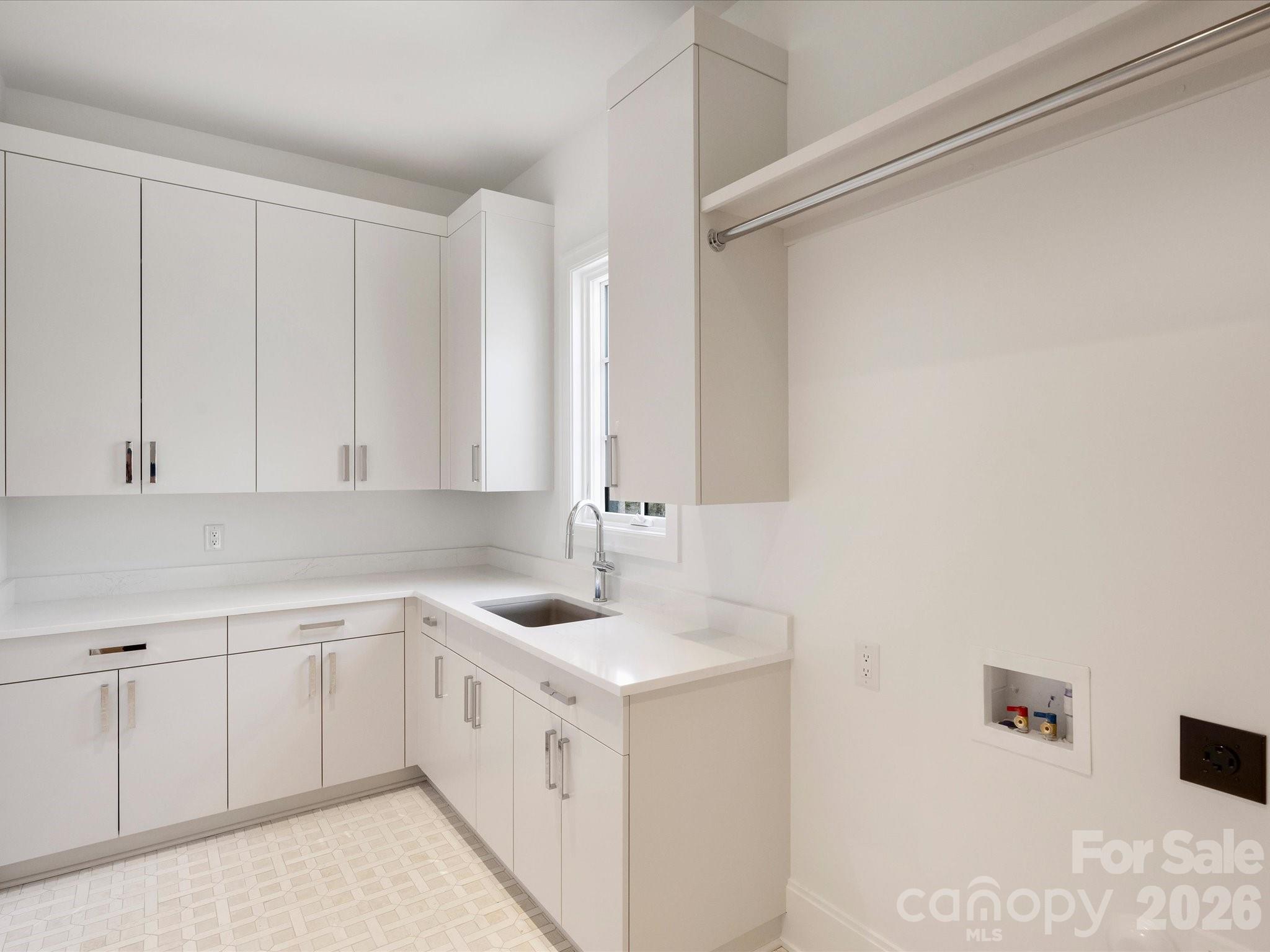 1436 Queens Road West Charlotte, NC 28207 - Photo 36 of 47 a kitchen with a sink and cabinets