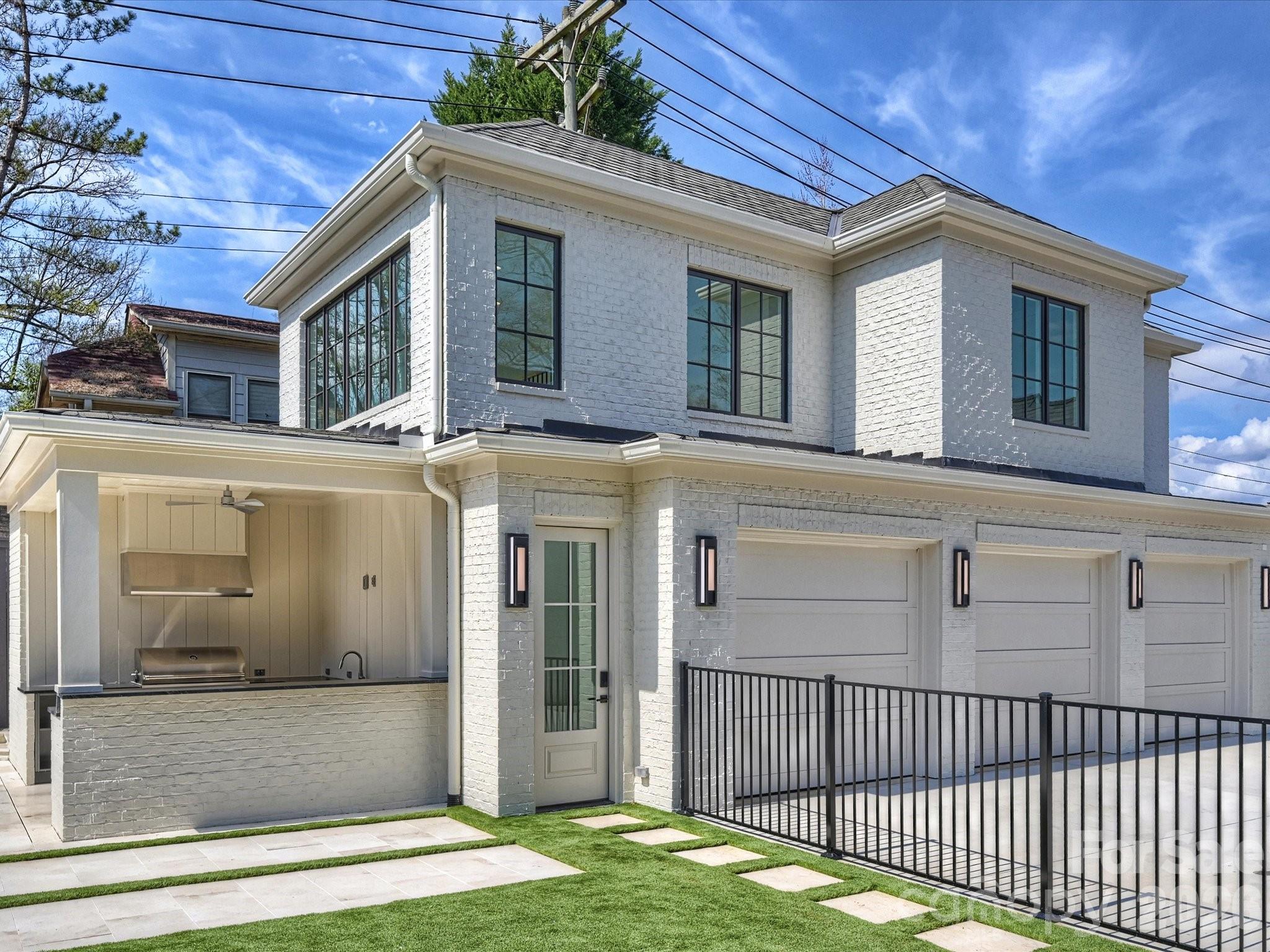 1436 Queens Road West Charlotte, NC 28207 - Photo 40 of 47 a front view of a house with garage