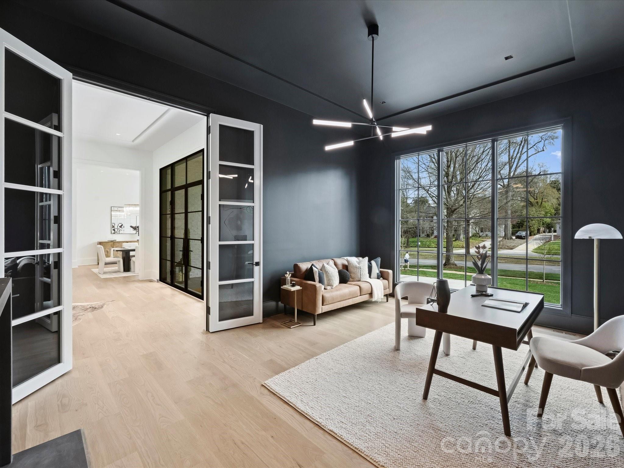 1436 Queens Road West Charlotte, NC 28207 - Photo 10 of 47 a dining room with furniture and a floor to ceiling window