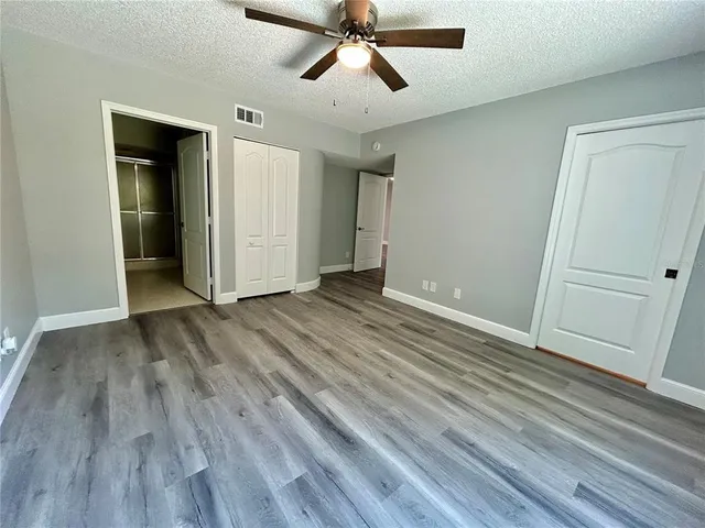 wooden floor with a bathroom
