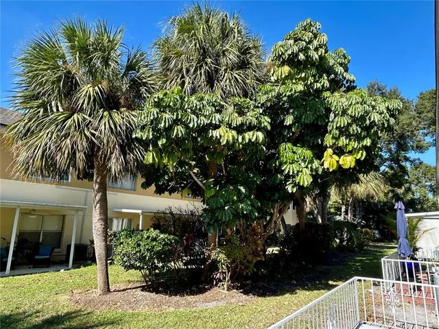 a view of a swimming pool and an outdoor seating