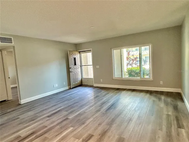 a kitchen with stainless steel appliances a refrigerator sink and microwave