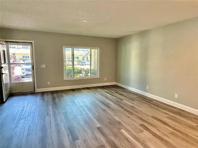 a kitchen with stainless steel appliances a refrigerator stove and microwave