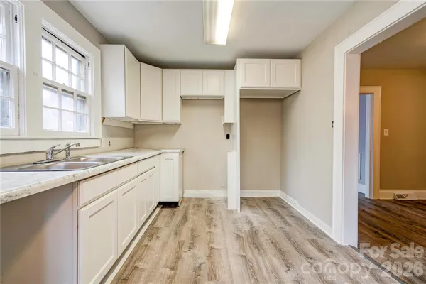 a kitchen with a sink stove and refrigerator