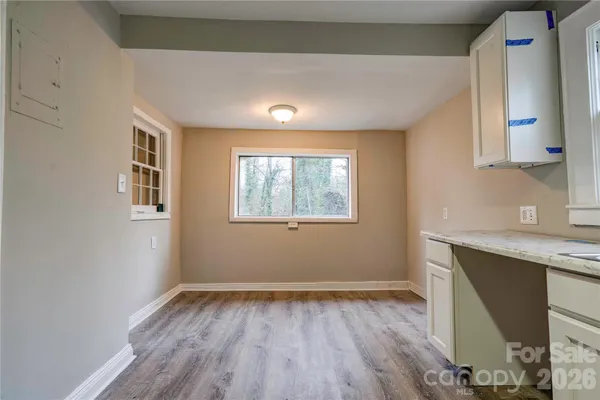 a view of a kitchen with a sink and a window