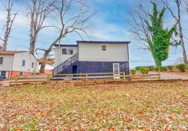 a house with trees in the background