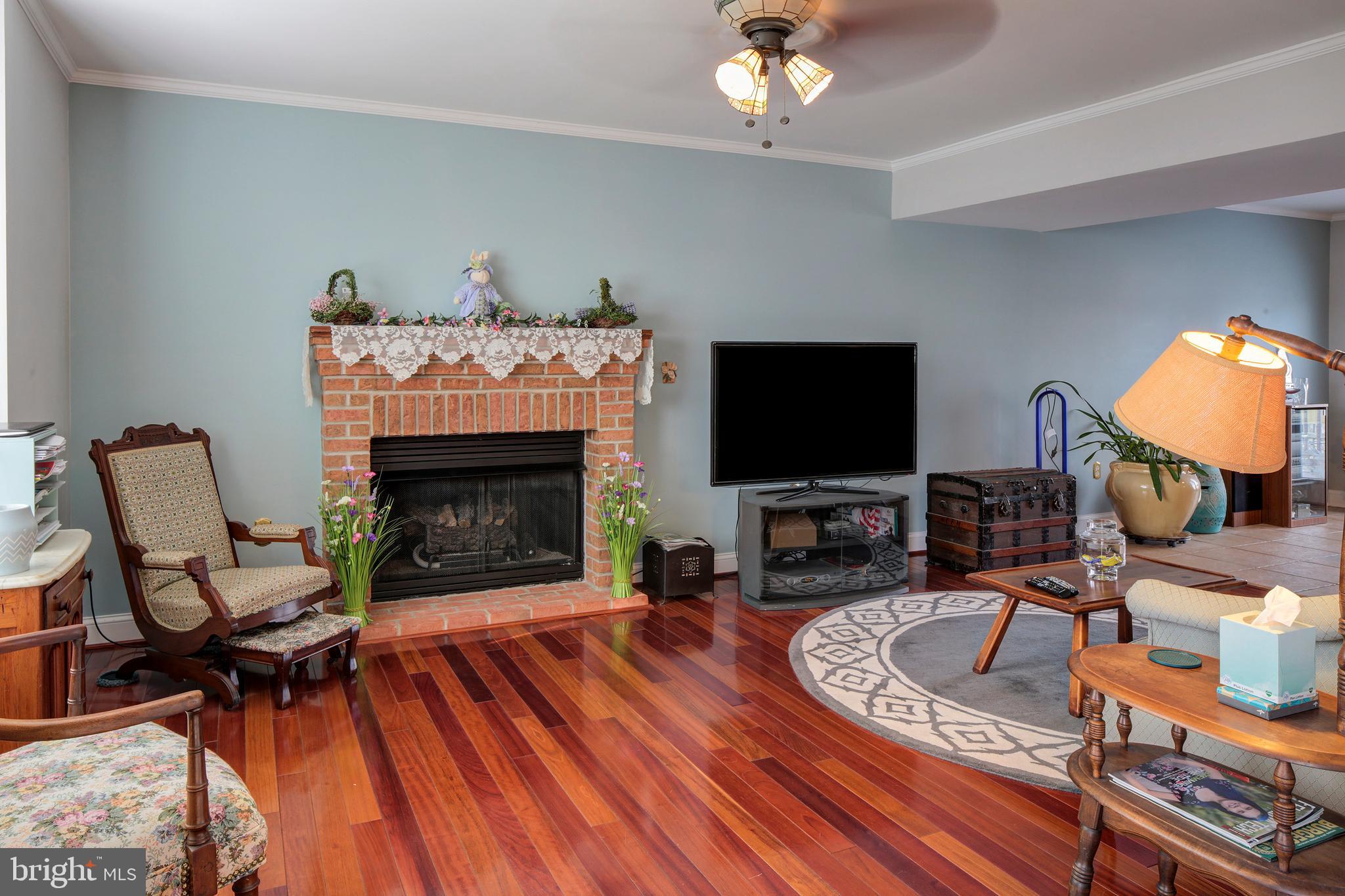 8 Somerset Road Pasadena, MD 21122 - Photo 6 of 36 Living Room with hardwood floors & propane FP