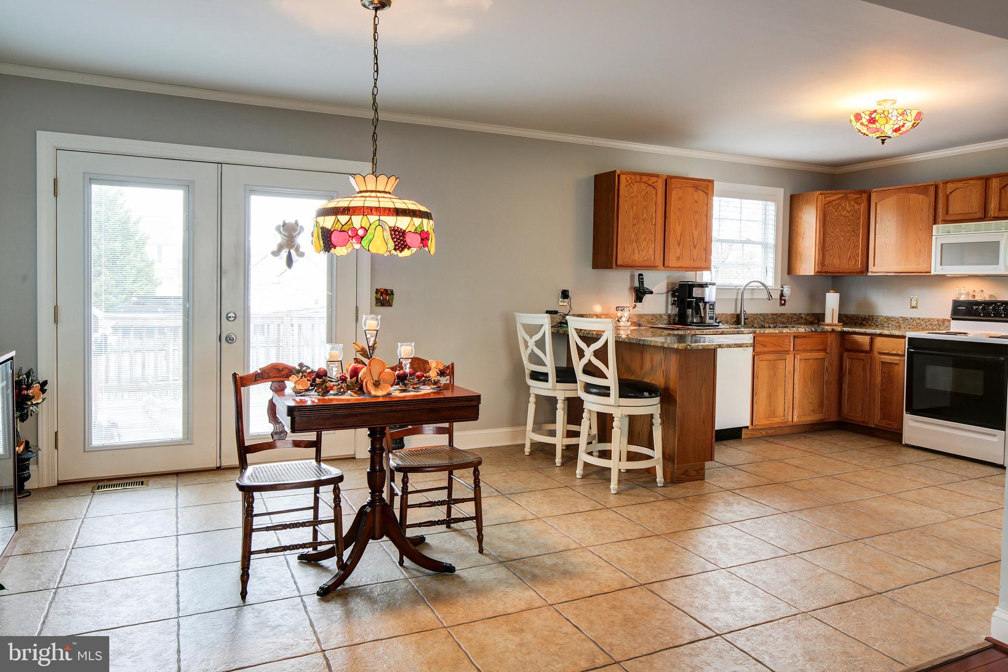 8 Somerset Road Pasadena, MD 21122 - Photo 8 of 36 Dining Area - ceramic tile & French Doors to deck