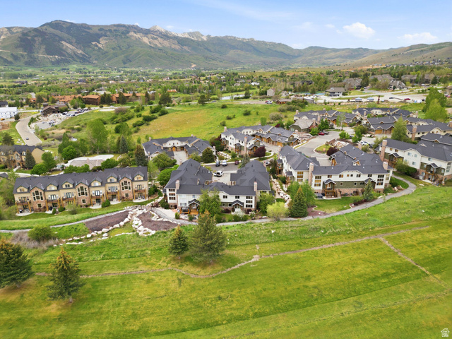 3634 North Huntsman Path, Unit C203 Eden, UT 84310 - Photo 27 of 27 Expansive hillside community featuring multiple multi-story townhome-style residences with dark roofing, light-toned siding, and surrounding green spaces