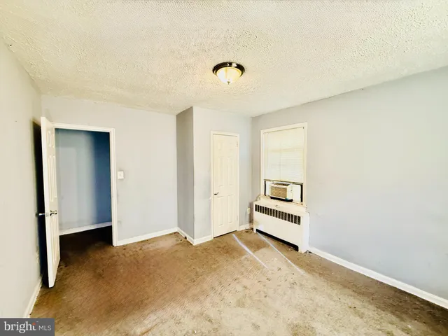 a large bathroom with a sink a vanity and a mirror