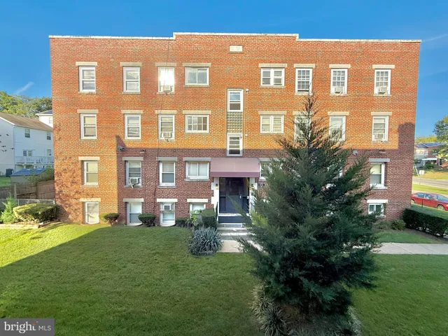 a view of a building with a yard