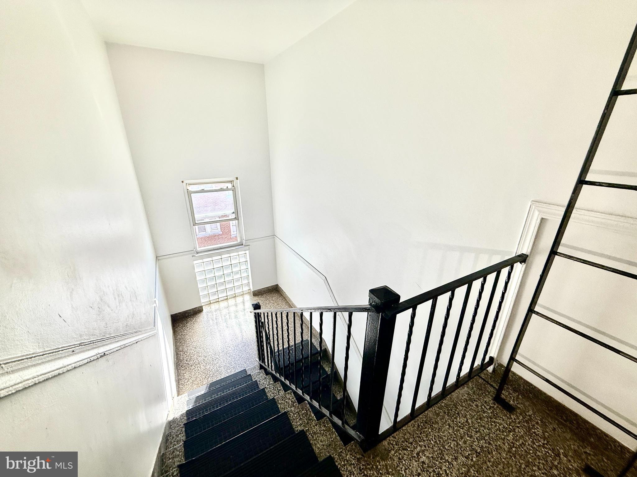 5111 Ayers Place Southeast Washington, DC 20019 - Photo 8 of 17 a view of a hallway with wooden floor and stairs