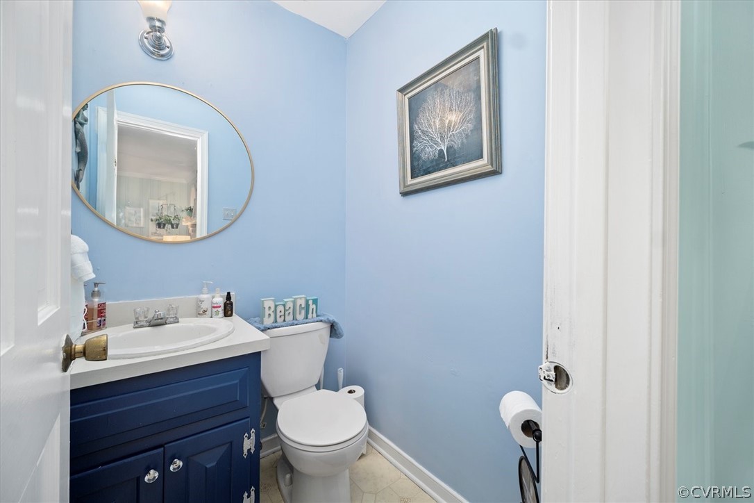 2820 Kinvan Road Richmond, VA 23231 - Photo 10 of 48 a bathroom with a toilet sink and mirror