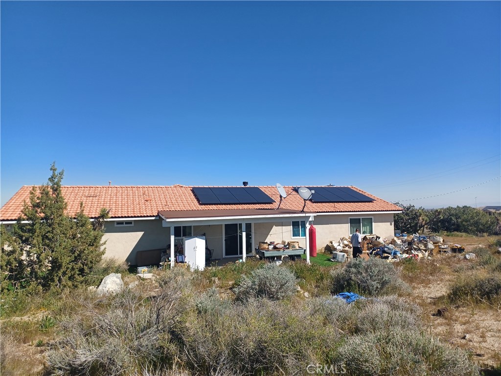 445 Solano Road Pinon Hills, CA 92372 - Photo 5 of 17 a front view of a house with a yard
