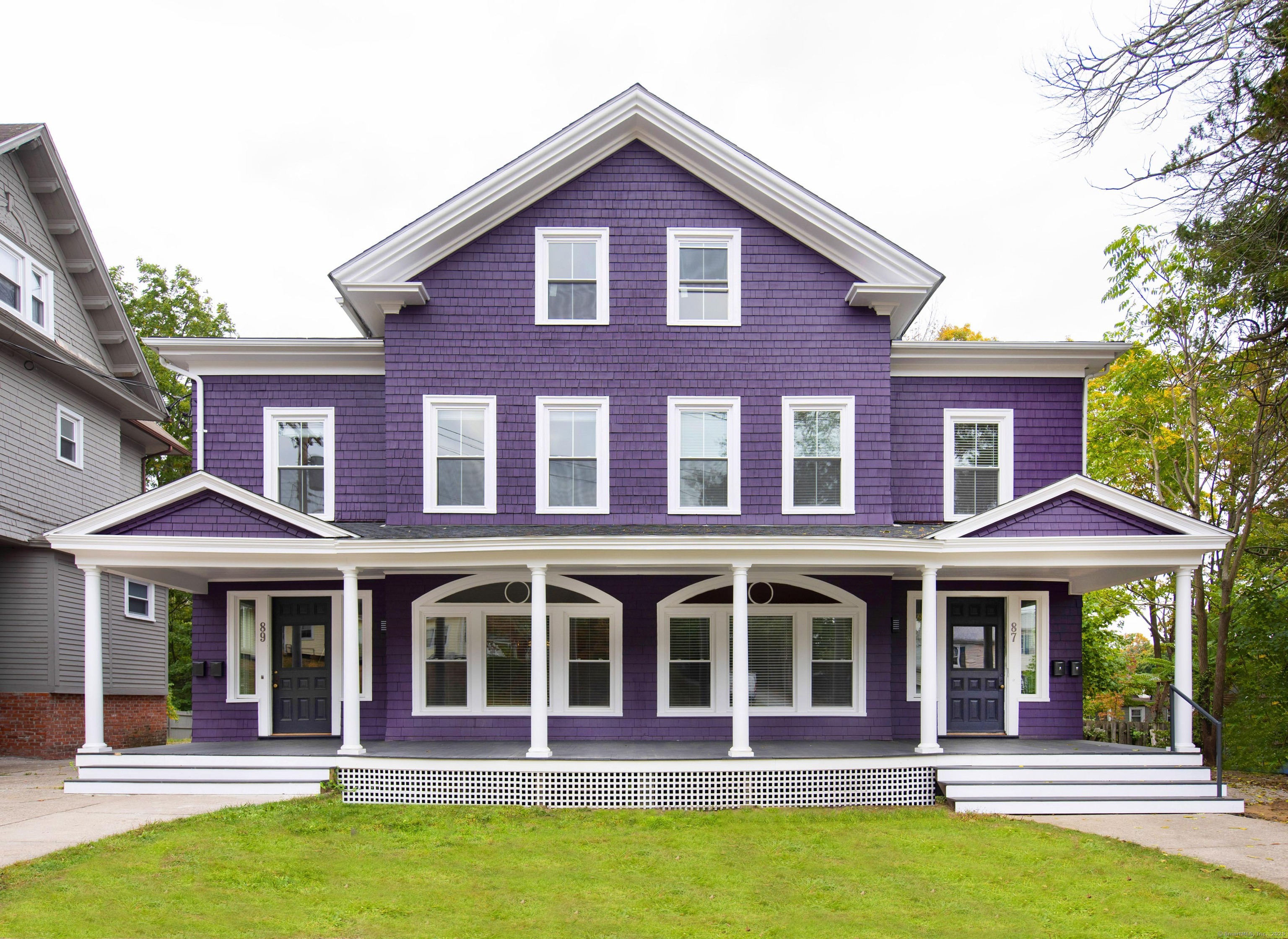 87 Broad Street Norwich, CT 06360 - Photo 1 of 29 a front view of a house with swimming pool and porch