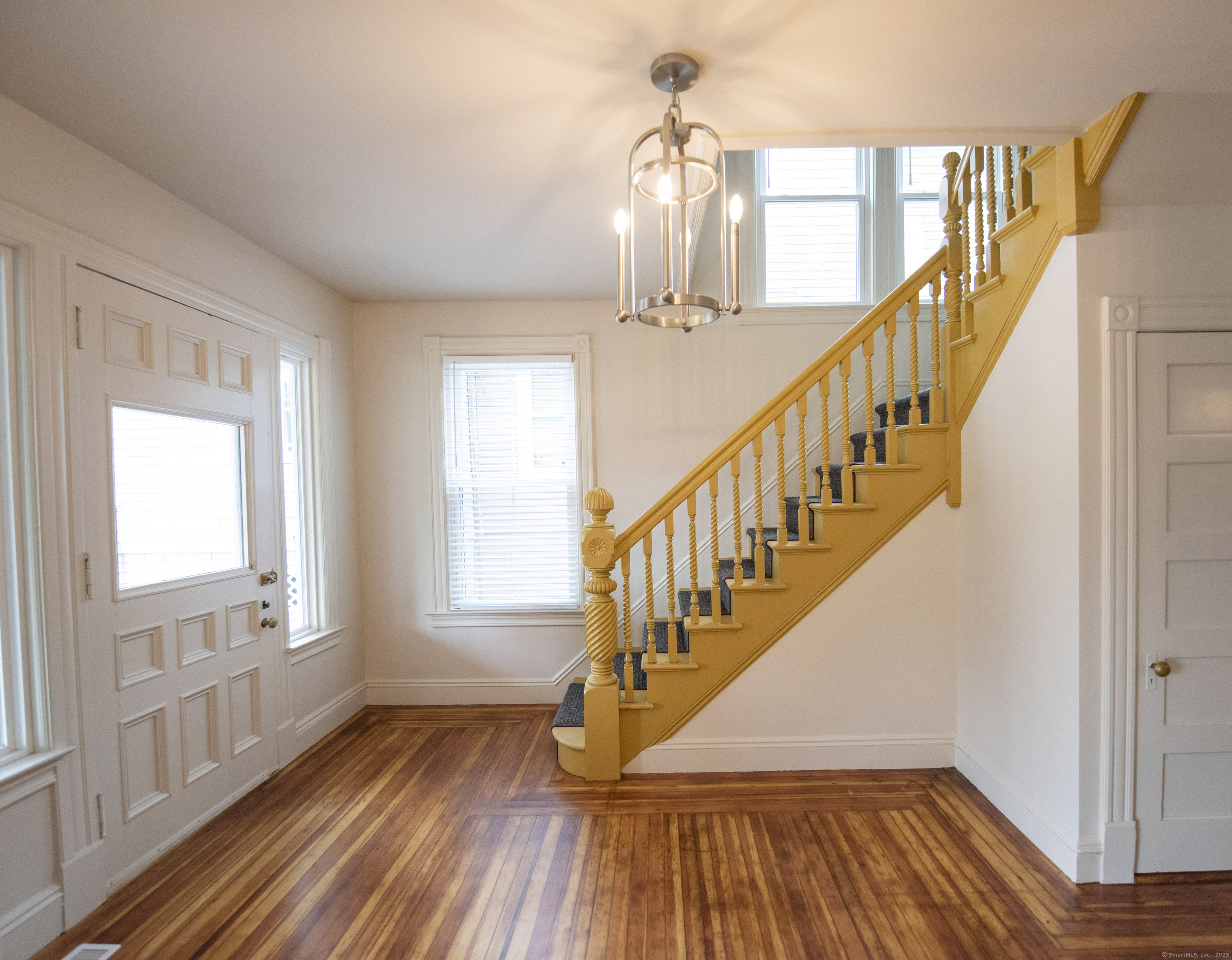 87 Broad Street Norwich, CT 06360 - Photo 19 of 29 a view of entryway with wooden floor