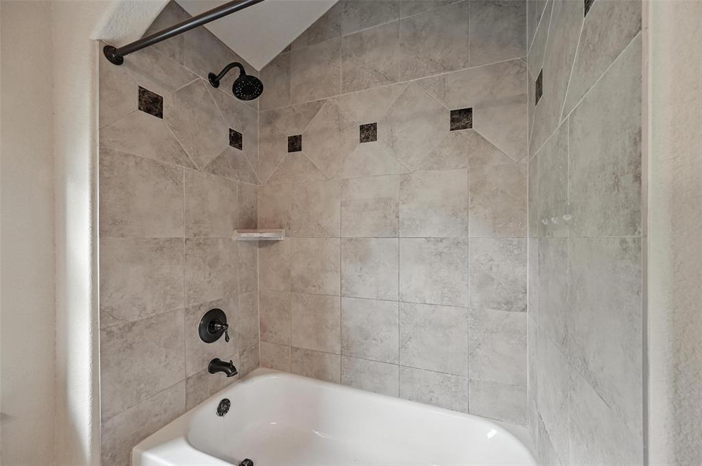 5535 Willis Avenue Dallas, TX 75206 - Photo 16 of 22 a bathroom with a bathtub