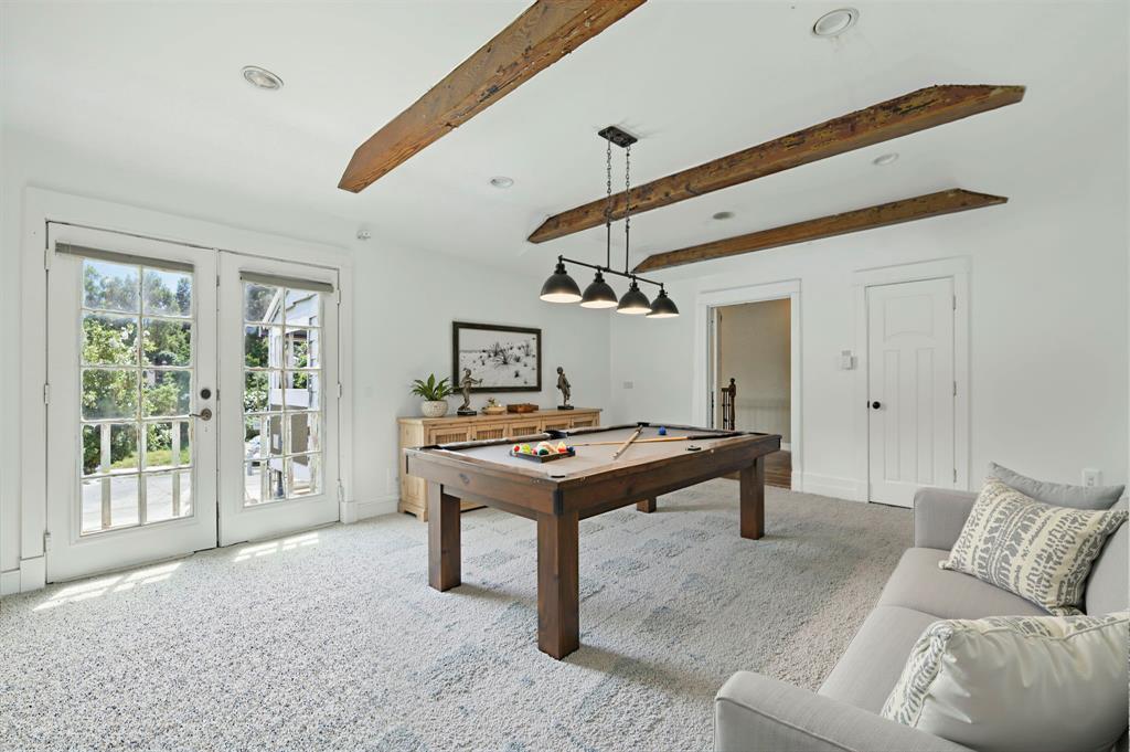 5535 Willis Avenue Dallas, TX 75206 - Photo 17 of 22 a living room with furniture a rug and white walls
