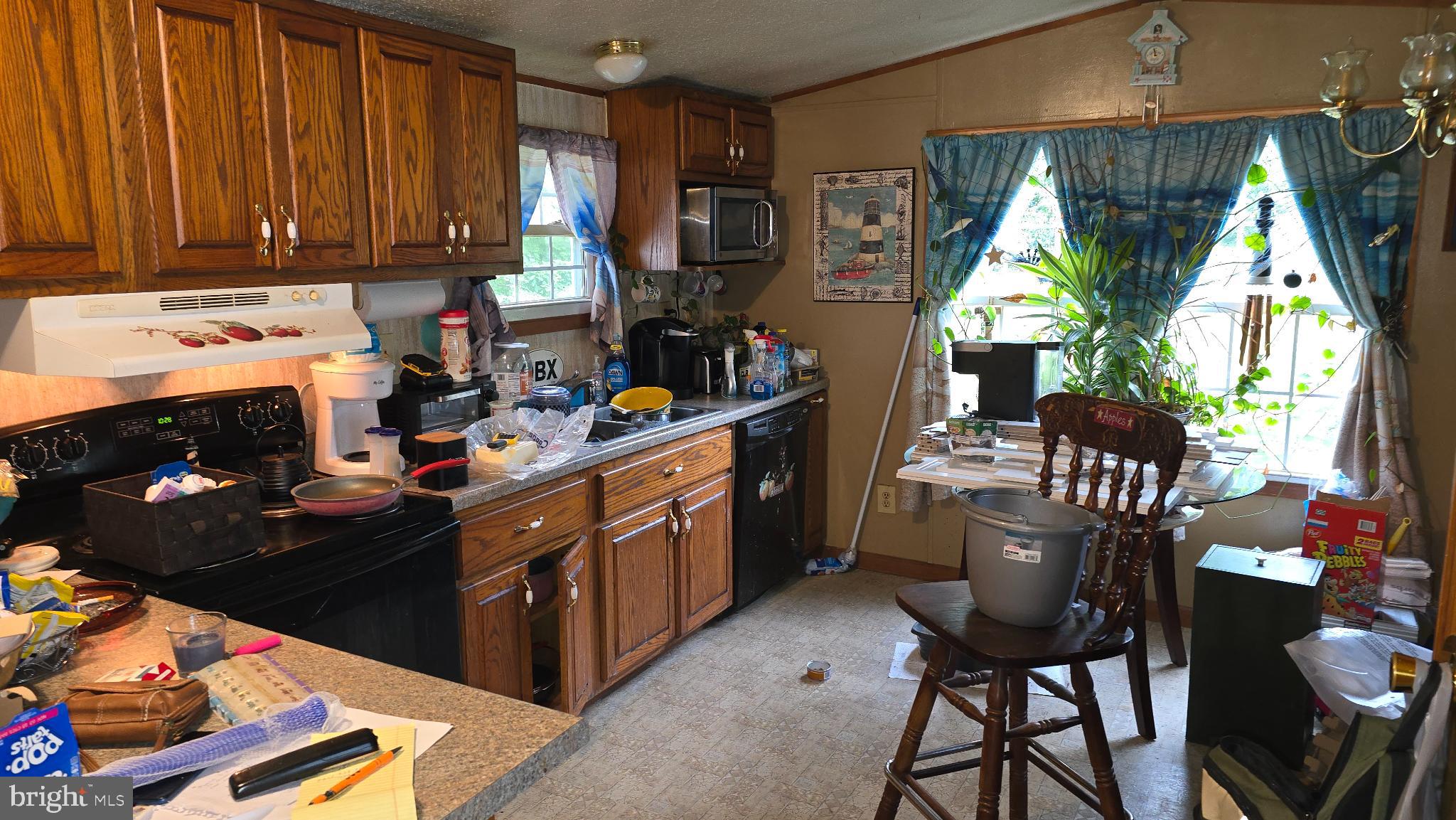 7 Hummels Lane McClure, PA 17841 - Photo 2 of 33 a kitchen with stainless steel appliances kitchen island granite countertop a stove a sink dishwasher and cabinets