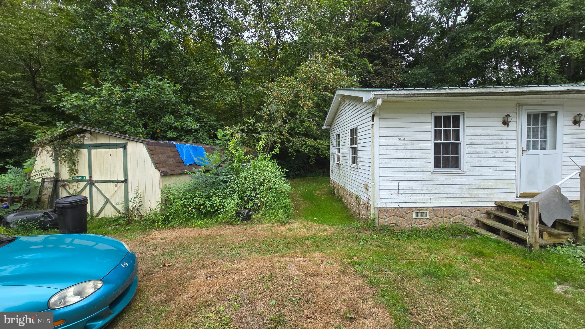 7 Hummels Lane McClure, PA 17841 - Photo 27 of 33 a view of a backyard with plants and a barbeque