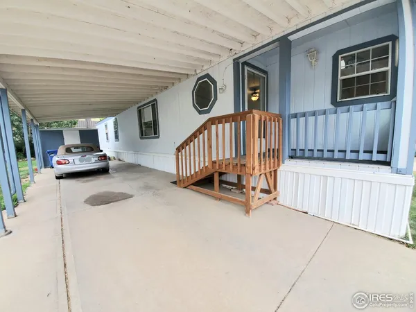 a view of car parked in front of house