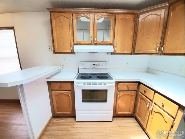 a kitchen with stainless steel appliances a stove a sink and a microwave