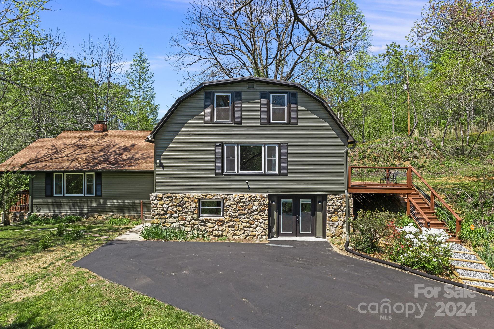 a front view of a house with a garden