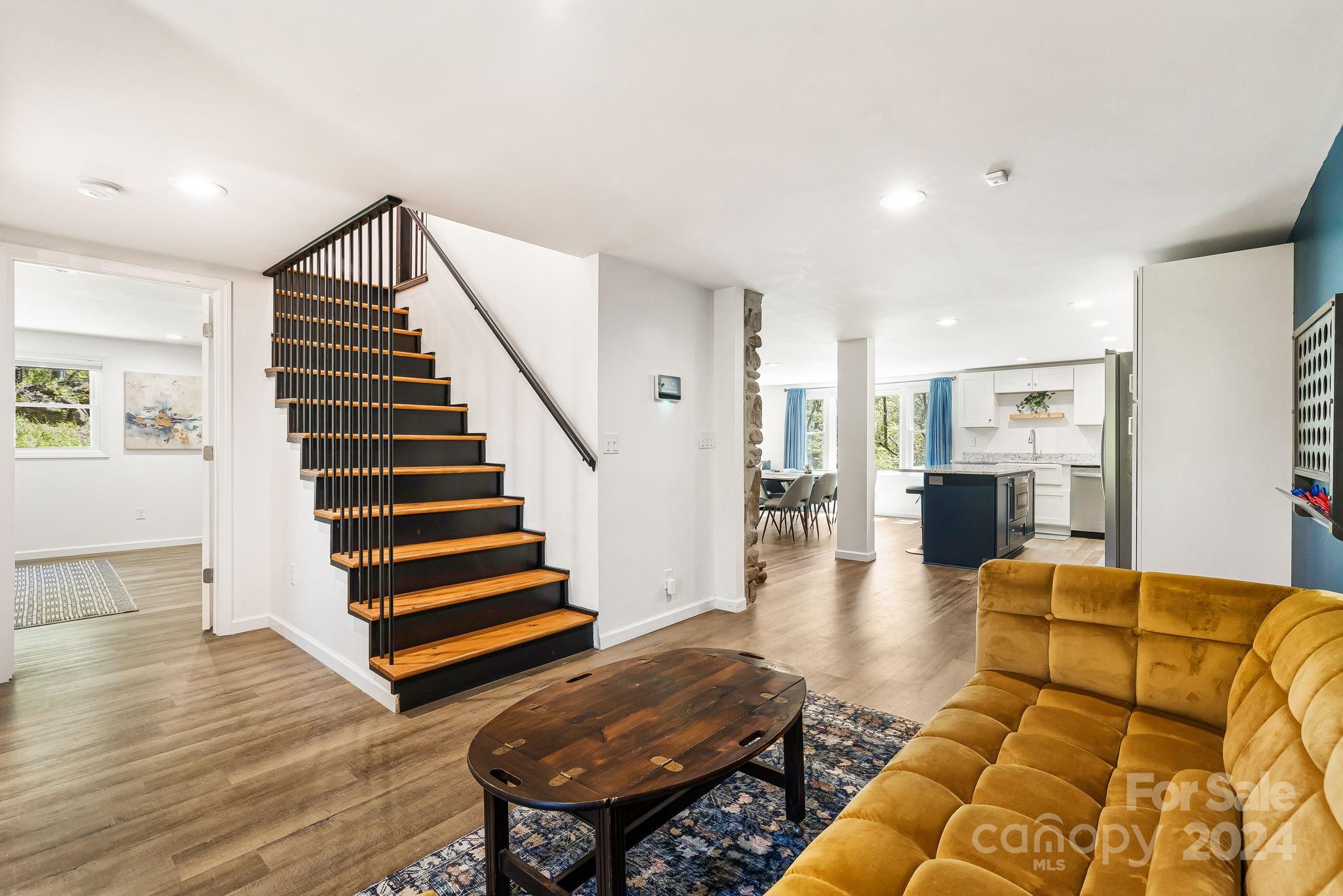 850 East Fork Road Marshall, NC 28753 - Photo 11 of 48 a living room with furniture and wooden floor