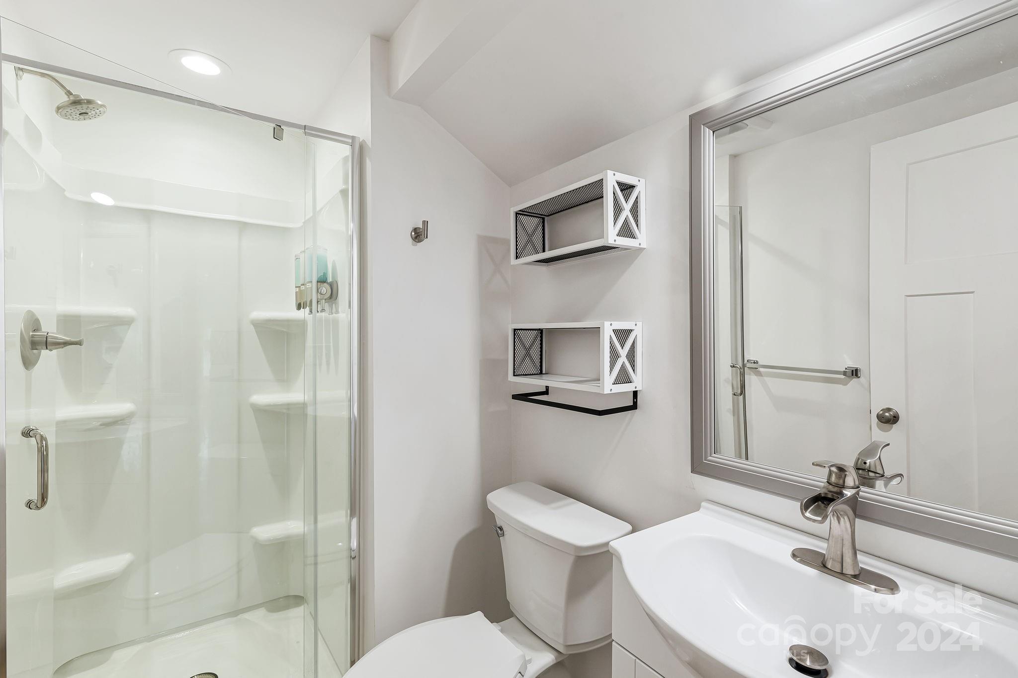 850 East Fork Road Marshall, NC 28753 - Photo 13 of 48 a bathroom with a sink toilet and shower
