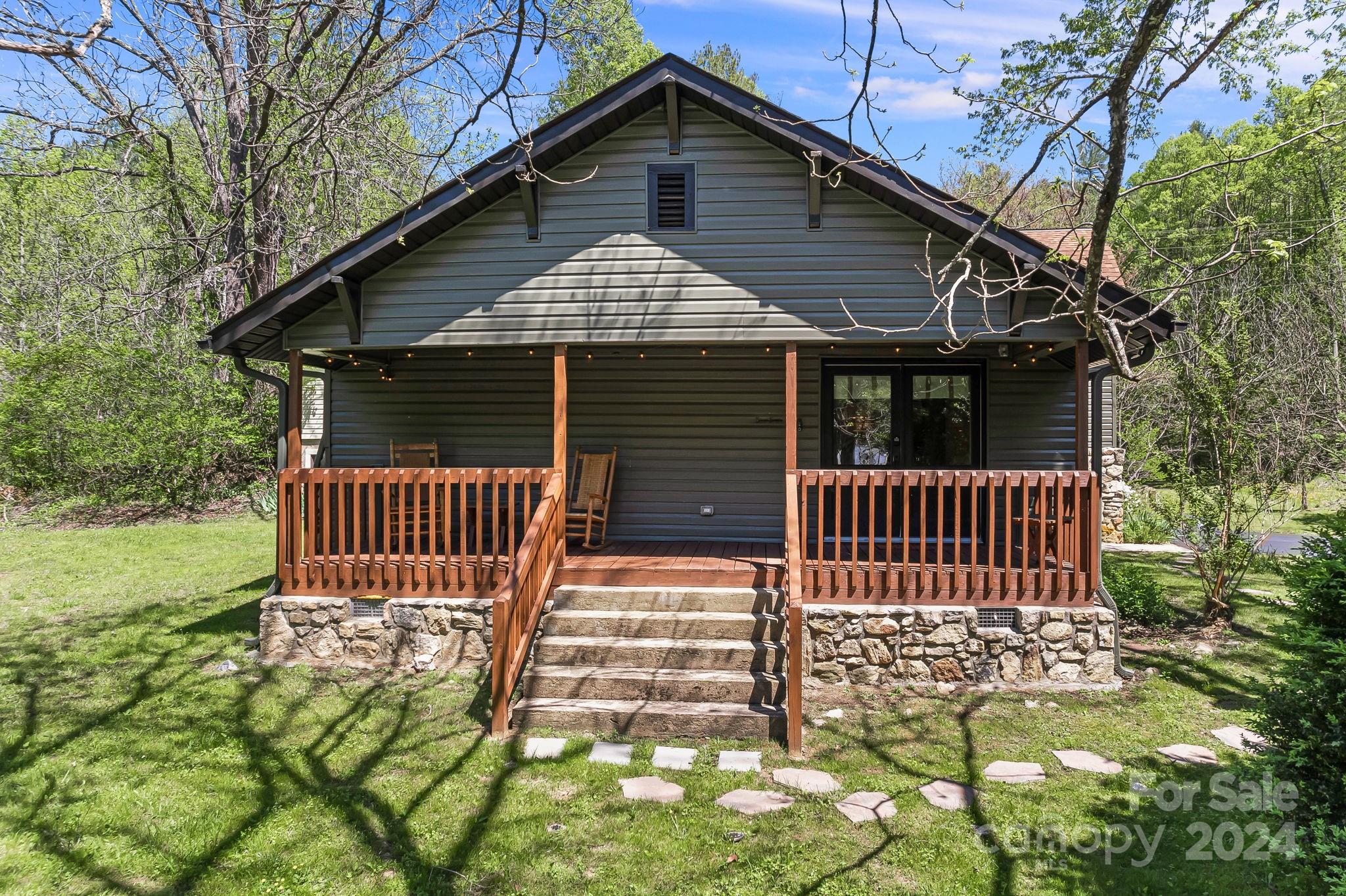 850 East Fork Road Marshall, NC 28753 - Photo 17 of 48 a front view of a house with a garden